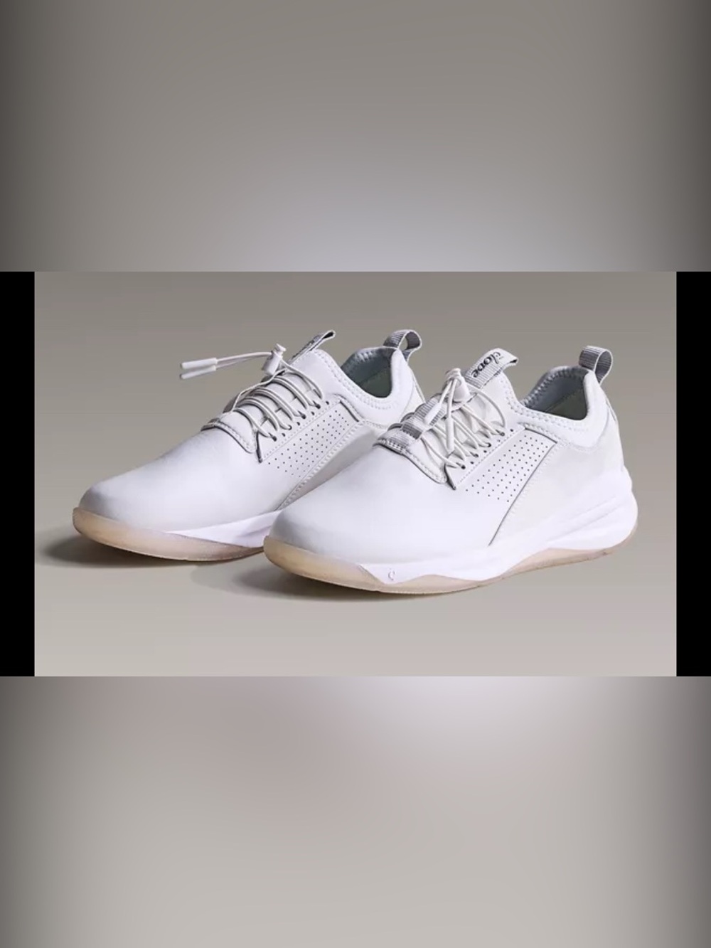 Clove nursing sneakers a bungee lacing system and perforated side panels